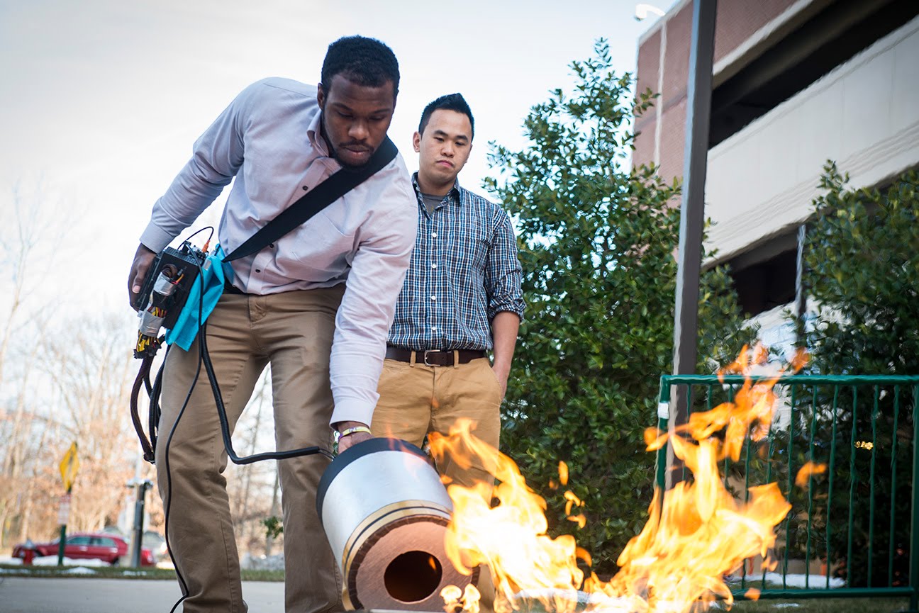 Inventors testing sonic fire extinguishing